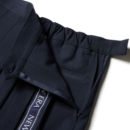 GFW PLEATS SK VERTICAL LOGO